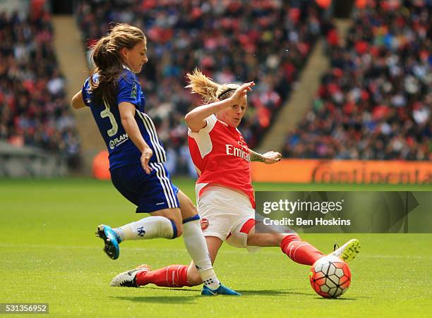 Kelly Smith of Arsenal stretches to tackle Hannah Blundell of Chelsea during the SSE Women's FA Cup Final between Arsenal Ladies and Chelsea Ladies...