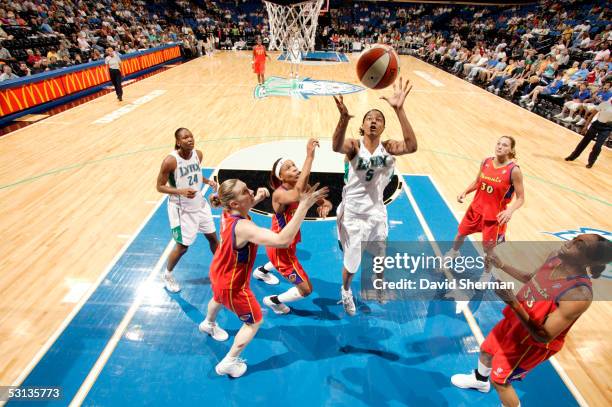 Stacey Lovelace-Tolbert of the Minnesota Lynx rebounds against the Phoenix Mercury on June 22, 2005 at the Target Center in Minneapolis, Minnesota....