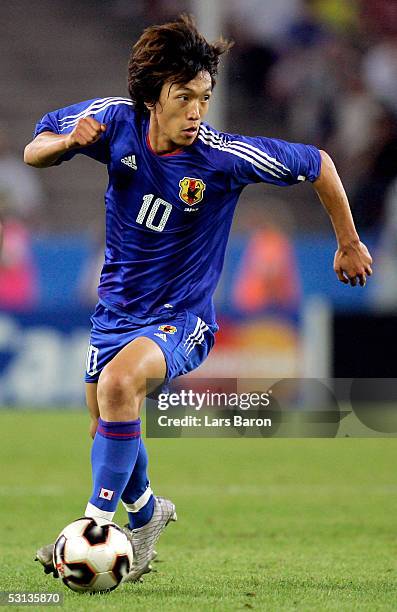 Shunsuke Nakamura from Japan runs with the ball during the match between Japan and Brazil for the Confederations Cup 2005 on June 22, 2005 at the...