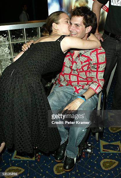 Rugby Player Keith Cavill and Actress Winona Ryder attend the premiere of "Murderball" on June 22, 2005 in New York City.