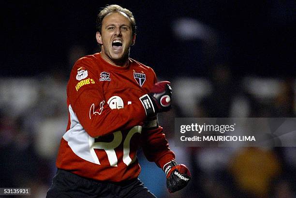 Sao Paulo's goalkeeper Rogerio Ceni celebrates his kick penalty goal, the second of his team scored against River Plate, during their Libertadores...