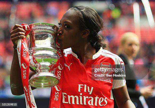 Winning goalscorer Danielle Carter of Arsenal kisses the trophy after the SSE Women's FA Cup Final between Arsenal Ladies and Chelsea Ladies at...