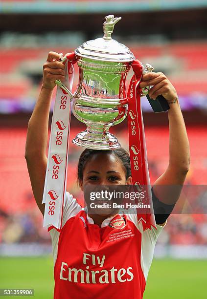 Captain Alex Scott of Arsenal celebrates with the trophy after the SSE Women's FA Cup Final between Arsenal Ladies and Chelsea Ladies at Wembley...