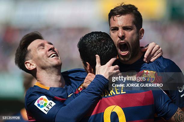 Barcelona's Uruguayan forward Luis Suarez ccelebrates a goal with Barcelona's defender Jordi Alba and Barcelona's Argentinian forward Lionel Messi...