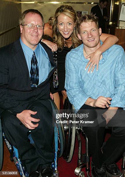 Coach Kevin Orr, Rugby player Scott Hogsett and guest attend the after party for the premiere of "Murderball" on June 22, 2005 in New York City.