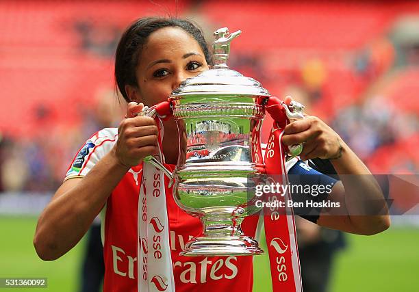 Captain Alex Scott of Arsenal kisses the trophy after the SSE Women's FA Cup Final between Arsenal Ladies and Chelsea Ladies at Wembley Stadium on...