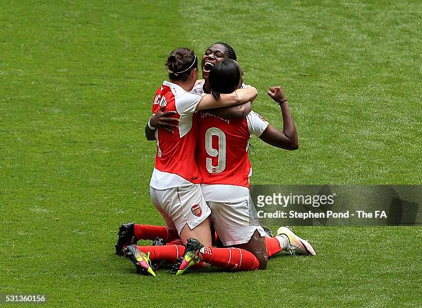 Danielle Carter, Asisat Oshoala and Natalia Pablos Sanchon of Arsenal Ladies celebrate victory on the final whistle during the SSE Women's FA Cup...