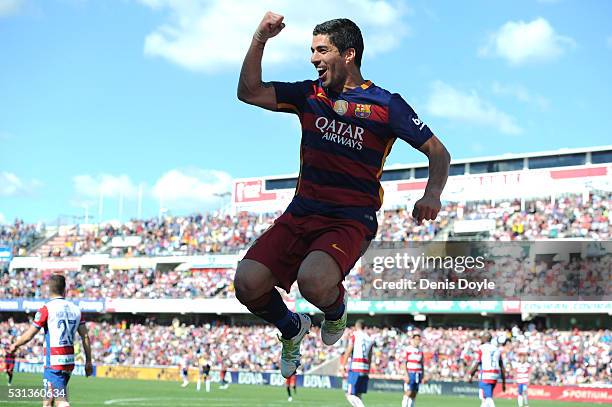 Luis Suarez of Barcelona celebrates scoring his team's second goal during the La Liga match between Granada and Barcelona at Estadio Nuevo Los...