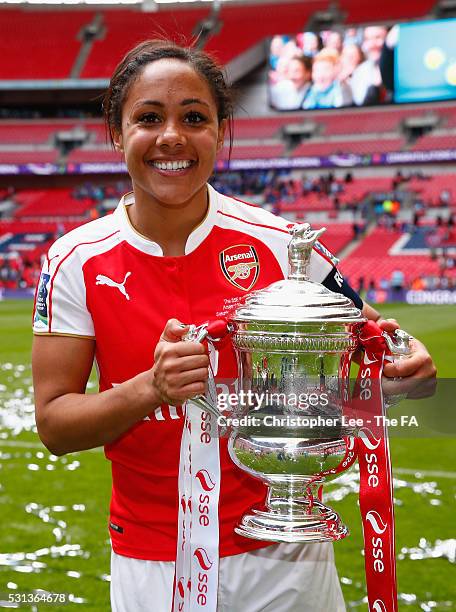 Alex Scott of Arsenal celebrates their victory with the FA Cup during the SSE Women's FA Cup Final between Arsenal Ladies and Chelsea Ladies at...