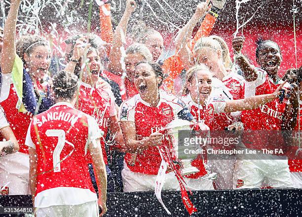 Captain Alex Scott of Arsenal celebrates their victory with her team mates and the FA Cup during the SSE Women's FA Cup Final between Arsenal Ladies...