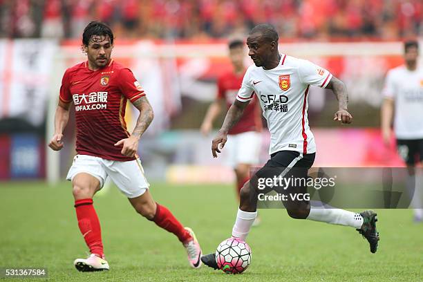 Ricardo Goulart of Guangzhou Evergrande and Gael Kakuta of Hebei China Fortune compete for the ball during the Chinese Football Association Super...