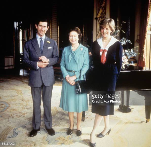 Queen Elizabeth II with Prince Charles and his fiancee Lady Diana Spencer at Buckingham Palace, 27th March 1981.