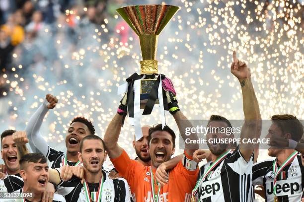 Juventus' goalkeeper Gianluigi Buffon from Italy and Juventus' players celebrate their Serie A title after the Italian Serie A football match...