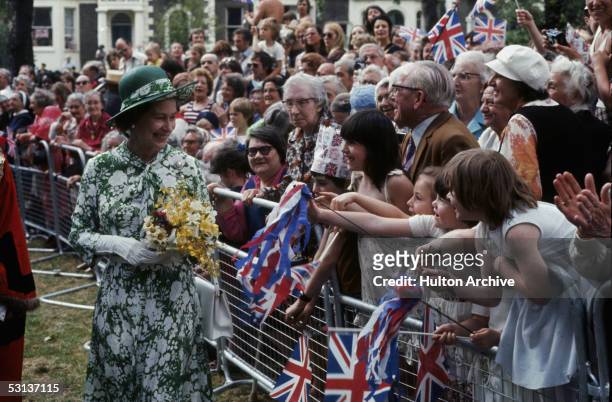 Queen Elizabeth II greets well-wishers in north London during celebrations of her Silver Jubilee, 1977.