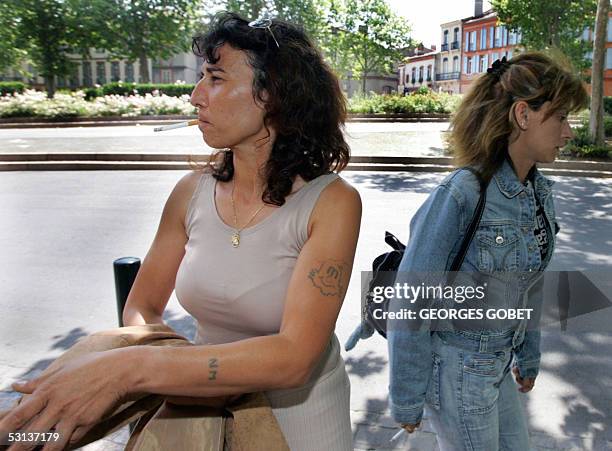 Former prostitutes Florence Khelifi known as Fanny and Christele Bourre known as Patricia leave the Toulouse court-house, 23 June 2005, where they...