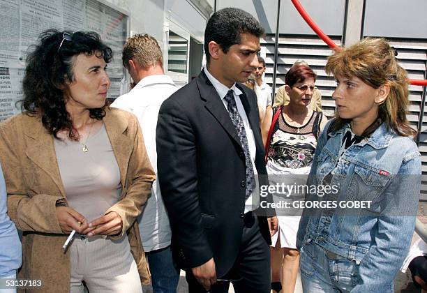 Former prostitutes Florence Khelifi known as Fanny and Christele Bourre known as Patricia leave the Toulouse court-house, 23 June 2005, where they...