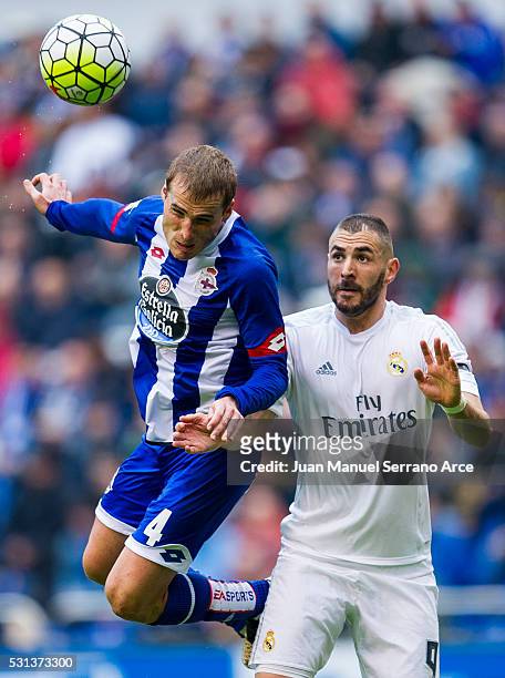 Karim Benzema of Real Madrid duels for the ball with Alex Bergantinos of RC Deportivo La Coruna during the La Liga match between RC Deportivo La...