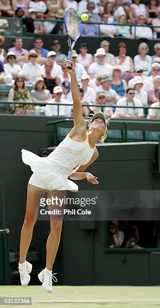 Maria Sharapova of Russia serves against Sesil Karatancheva of Bulgaria during the fourth day of the Wimbledon Lawn Tennis Championship on June 23,...
