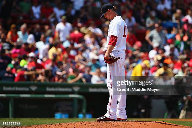 Clay Buchholz of the Boston Red Sox reacts after George Springer of the Houston Astros hit a grand slam during the second inning on May 14, 2016 in...