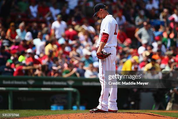 Clay Buchholz of the Boston Red Sox reacts after George Springer of the Houston Astros hit a grand slam during the second inning on May 14, 2016 in...