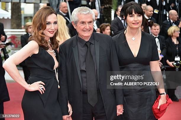 French director Claude Lelouch poses with his partner Valerie and French actress Elsa Zylberstein as they arrive on May 14, 2016 for the screening of...