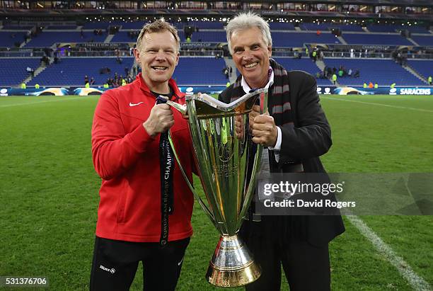 Director of Rugby Mark McCall and owner Nigel Wray of Saracens pose with the trophy after the European Rugby Champions Cup Final match between Racing...