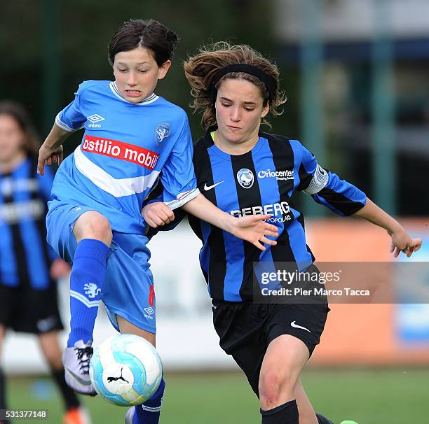 Veronica Pedrini of Atalanta BC competes for the ball with Susanna Ciocca of ACF Brescia during the Danone Nations Cup 2016 in Rome on May 14, 2016...