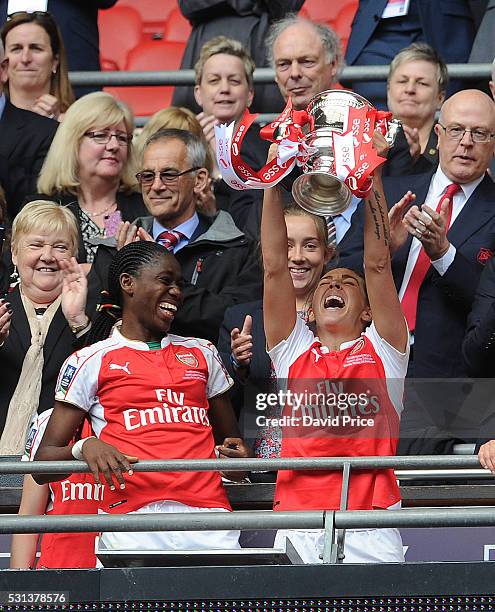 Fara Williams and Asisat Oshoala of Arsenal Ladies lift the FA Cup Trophy after the match between Arsenal Ladies and Chelsea Ladies at Wembley...