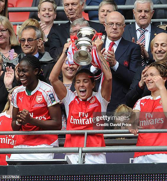 Fara Williams and Asisat Oshoala of Arsenal Ladies lift the FA Cup Trophy after the match between Arsenal Ladies and Chelsea Ladies at Wembley...