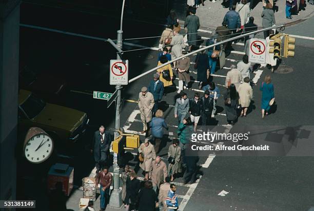 Pedestrian crossing on the corner of East 42nd Street and Madison Avenue in New York City, circa 1985.
