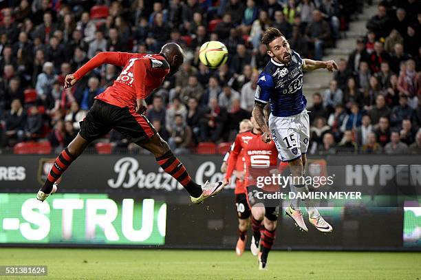 Rennes' Ivorian forward Giovanni Sio heads the ball close to Bastia's French defender Julian Palmieri during the French L1 football match between...