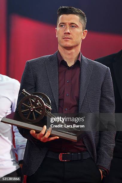 Robert Lewandowski holds his trophy for his 30 goals, becoming the 2015-16 Bundesliga top scorer during the FC Bayern Muenchen Bundesliga Champions...
