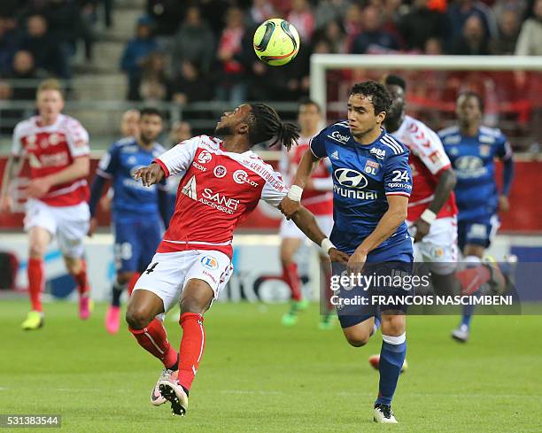 Reims' midfielder Lass Bangoura vies withLyon's Brazilian defender Rafael da Silva during the French Ligue 1 football match between Reims and Lyon on...