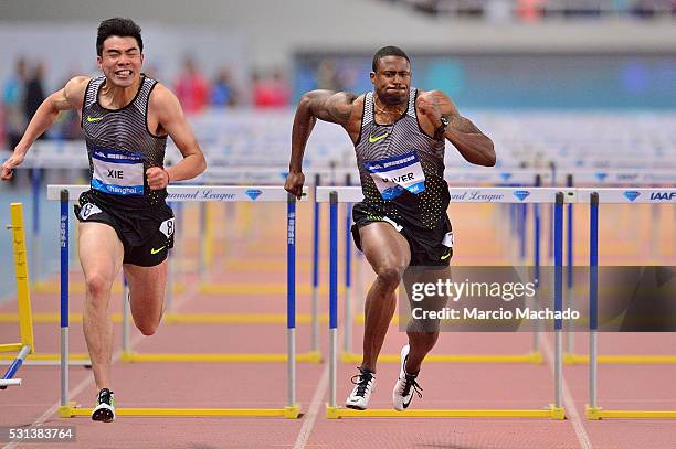 David Oliver of the United States and Xie Wenjun of China competing in the Men's 110 metres hurdles during the 2016 IAAF Diamond League at Shanghai...