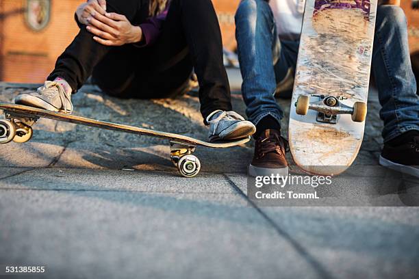 young skater relaxing - skateboarding stock pictures, royalty-free photos & images