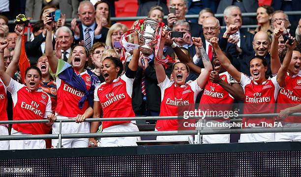 Alex Scott and Kelly Smith of Arsenal lift the FA Cup during the SSE Women's FA Cup Final between Arsenal Ladies and Chelsea Ladies at Wembley...