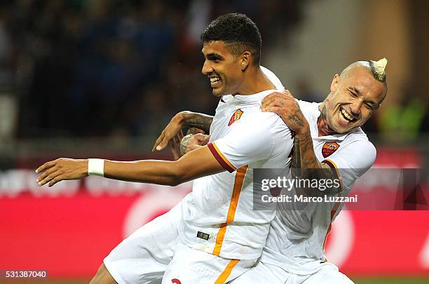 Emerson Palmieri of AS Roma celebrates his goal with his team-mate Radja Nainggolan during the Serie A match between AC Milan and AS Roma at Stadio...