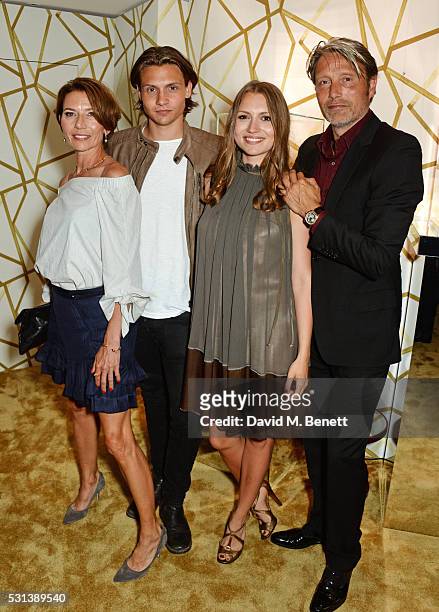 Mads Mikkelsen poses with wife Hanne Jacobsen and children Carl Jacobsen Mikkelsen and Viola Jacobsen Mikkelsen attend the Chopard x Annabel's Cannes...