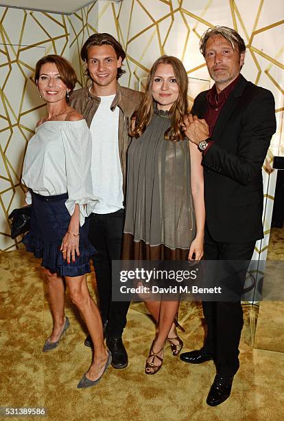 Mads Mikkelsen poses with wife Hanne Jacobsen and children Carl Jacobsen Mikkelsen and Viola Jacobsen Mikkelsen attend the Chopard x Annabel's Cannes...