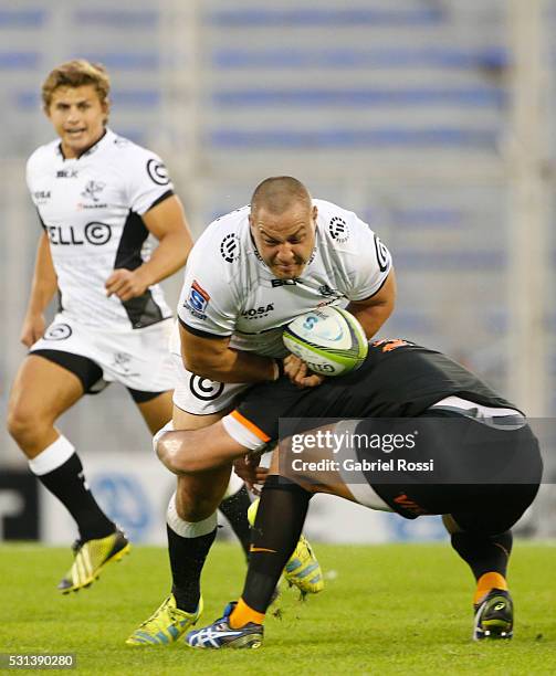 Coenie Oosthuizen of Sharks is tackled by Ramiro Herrera of Jaguares during a match between Jaguares and Sharks as part of Super Rugby 2016 at Jose...