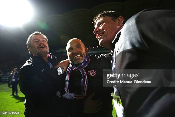 Head Coach Pascal Dupraz of Toulouse celebrates with his staff members after the football french Ligue 1 match between Angers SCO and Toulouse FC on...