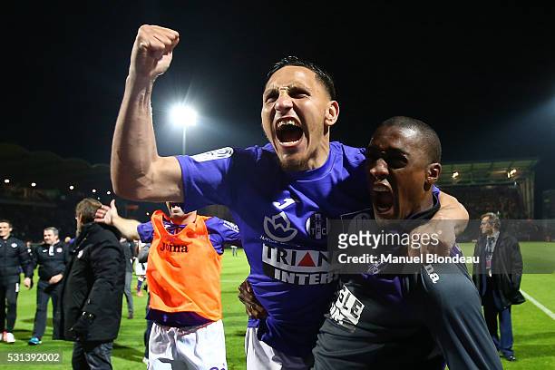 Adrien Regattin of Toulouse celebrates with Somalia after the football french Ligue 1 match between Angers SCO and Toulouse FC on May 14, 2016 in...