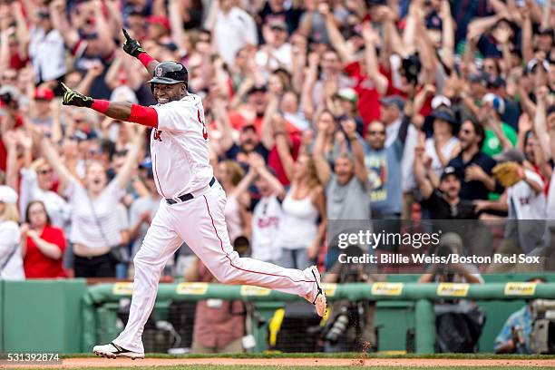 David Ortiz of the Boston Red Sox reacts after hitting a game winning walk-off single during the eleventh inning of a game against the Houston Astros...