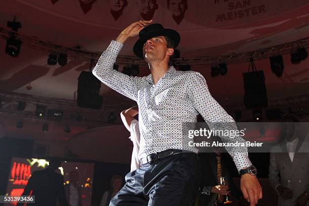 Thomas Muller dances as Music band, OneRepublic performs at the FC Bayern Muenchen Bundesliga Champions Dinner at the Postpalast on May 14, 2016 in...