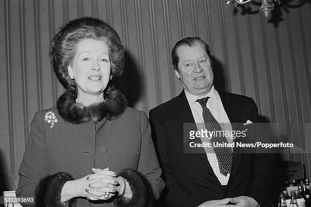 Raine Spencer, Countess Spencer, and John Spencer, 8th Earl Spencer , father and stepmother of Diana, Princess of Wales, pictured together in London...