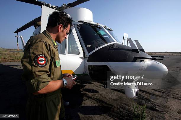 An Italian Custom Police "Guardia di Finanza" pilot gets ready to fly to search for boats loaded with illegal immigrants on June 21, 2005 in...