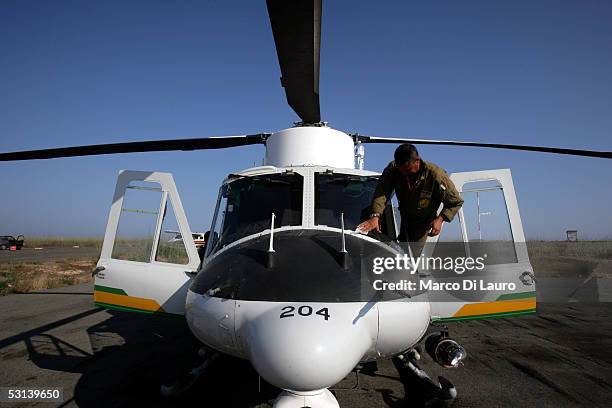 An Italian Custom Police "Guardia di Finanza" pilot gets ready to fly to search for boats loaded with illegal immigrants on June 21, 2005 in...