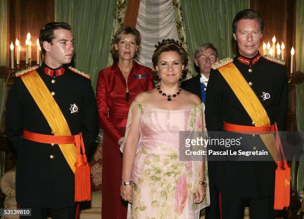 Crown Grand Duke Guillaume of Luxembourg, Grand Duchess Maria Theresa and Grand Duke Henri of Luxembourg attend a dinner at the Grand Ducal Palace as...