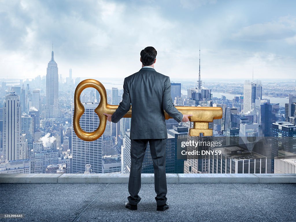 Businessman Holding The Key ToThe City