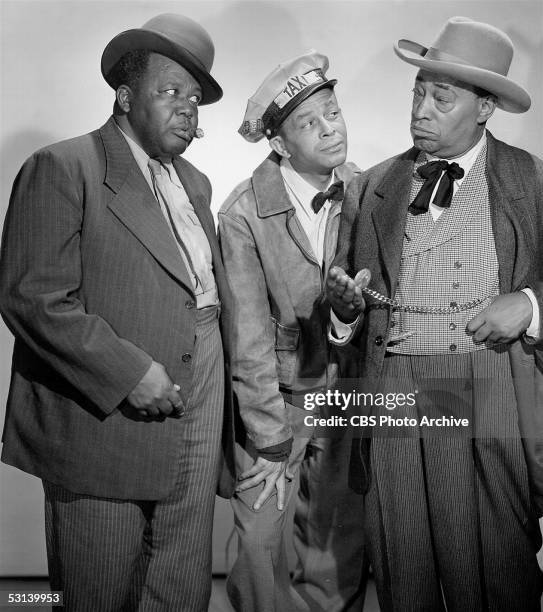 Promotional still from 'The Amos N' Andy Show,' 1951. From left, Spencer Williams , as Andy, and Alvin Childress , as Amos, watch as Tim Moore , as...